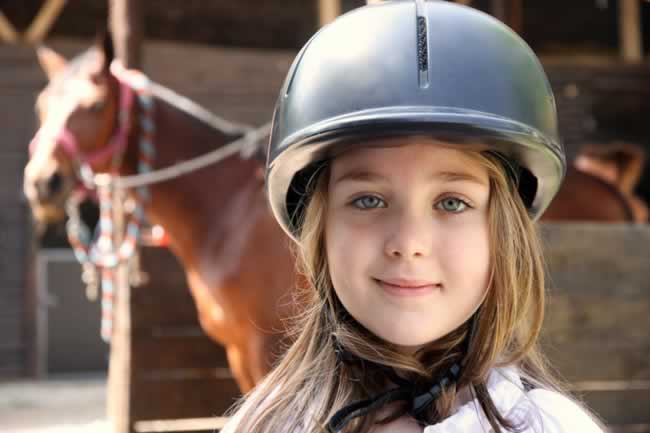 Girl in Helmet With Horse